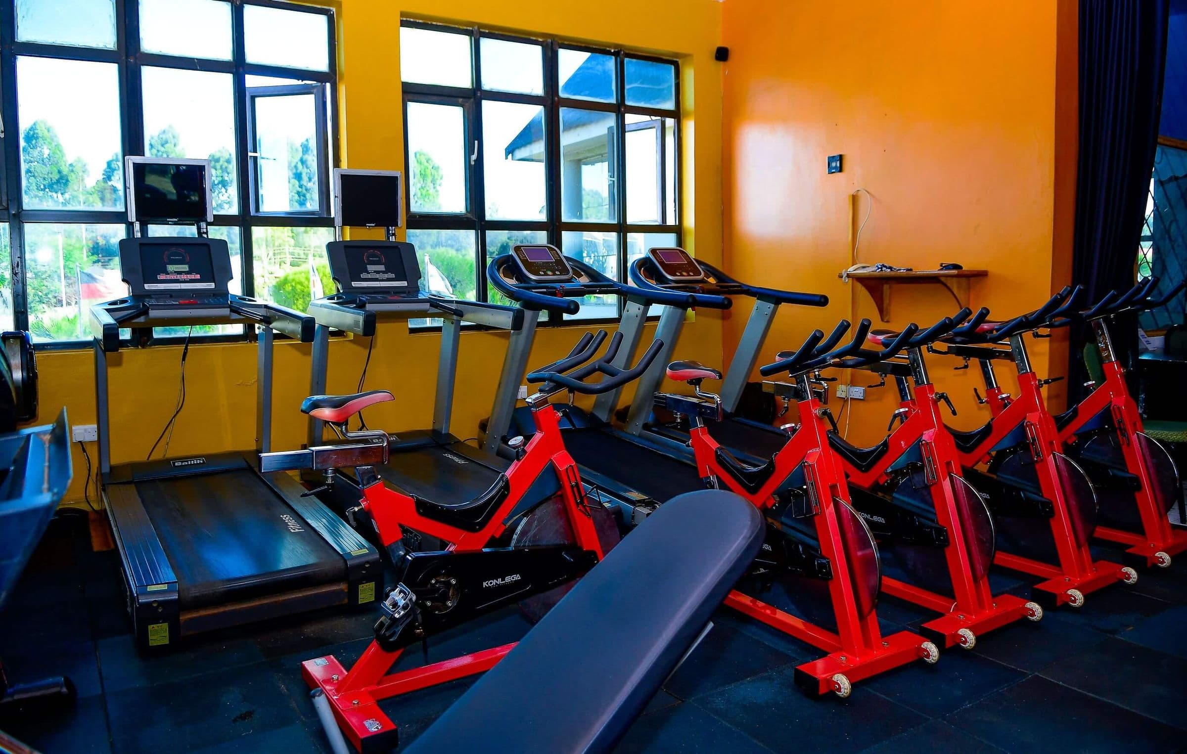 Gym floor with cardio and weights equipment at The Starbucks Hotel, Eldoret