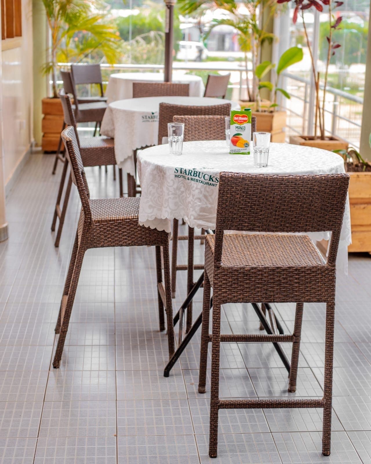 Terrace tables and chairs at The Starbucks Hotel restaurant, Eldoret