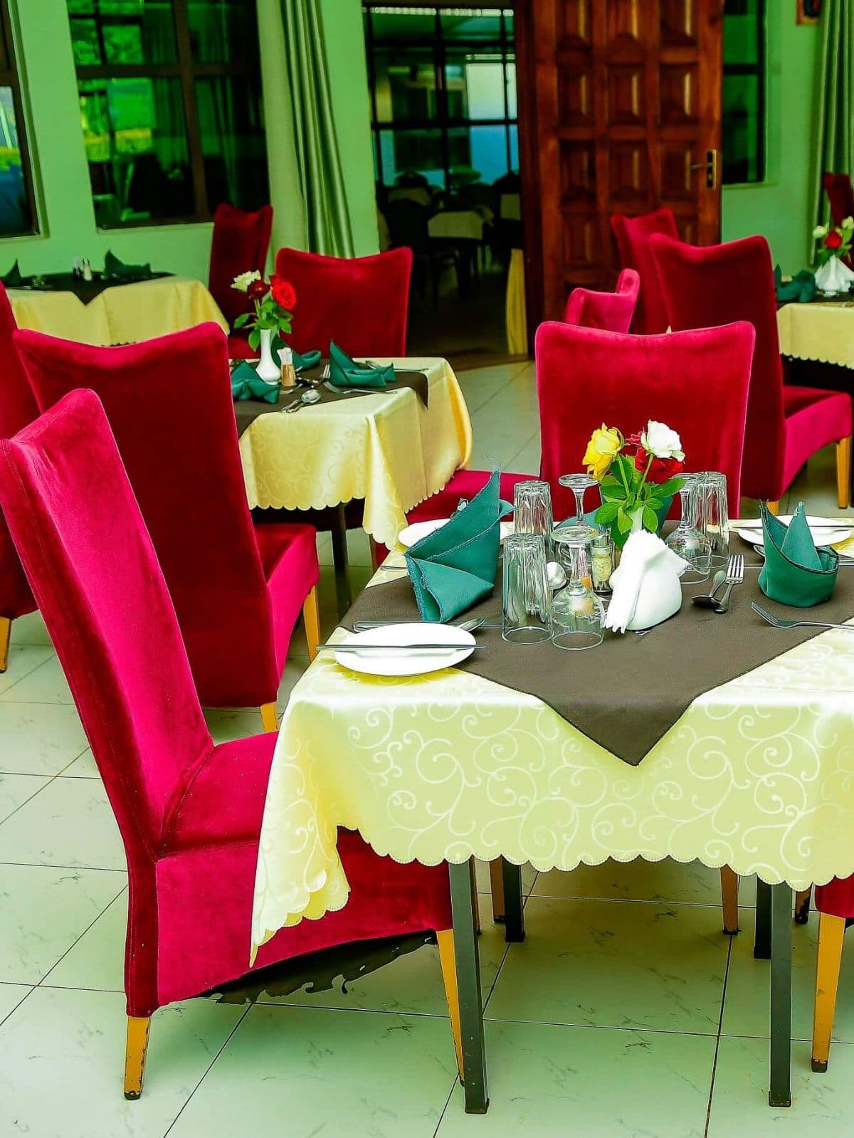 Dining room with set tables at The Starbucks Hotel restaurant, Eldoret